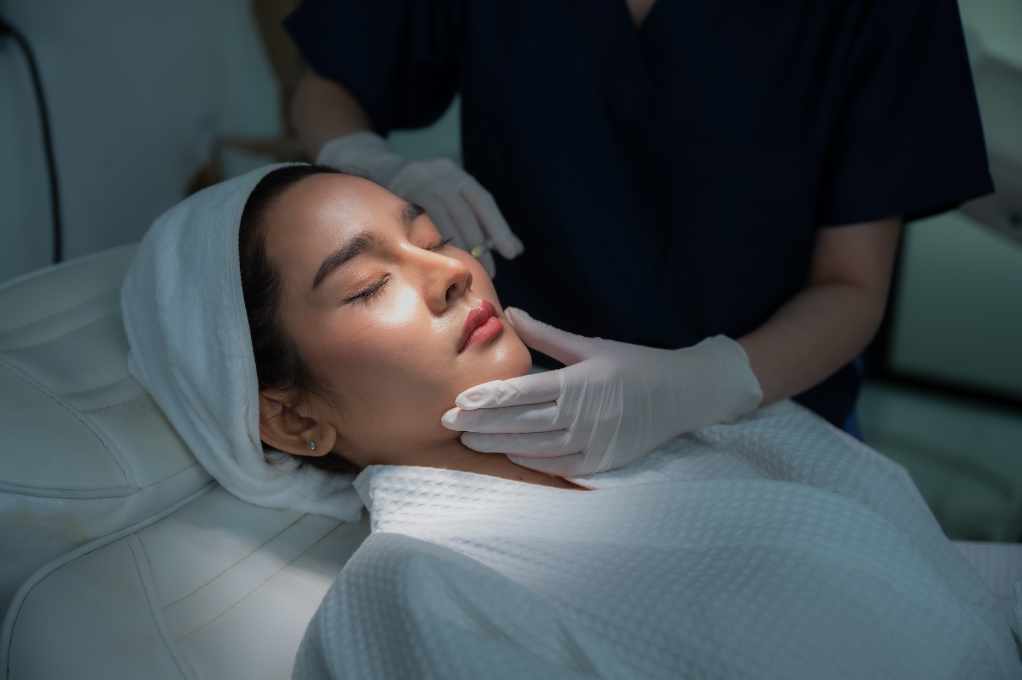 young Asian woman making cosmetology treatment skin injection, Mesotherapy of face beauty care
